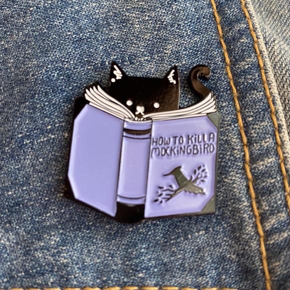 Cat reads “How to Kill a Mockingbird” - Picture 2 of 8